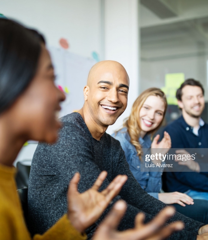 Group of diverse business people talking in a meeting. Business team smiling during a meeting.